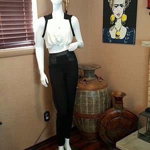 Black leggings with leather waist and sides.